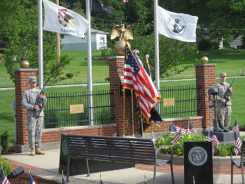 Flags flanked by soldiers